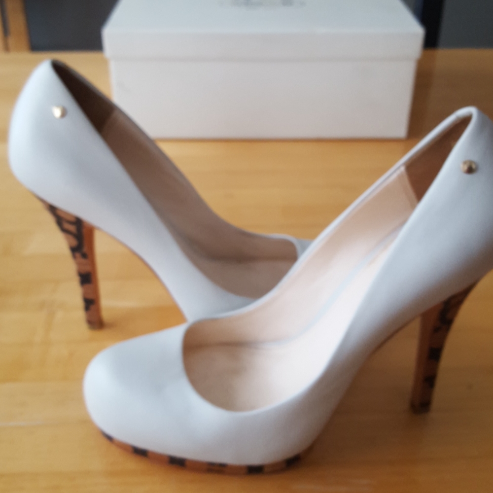 Coach. Bone colored leather heels.